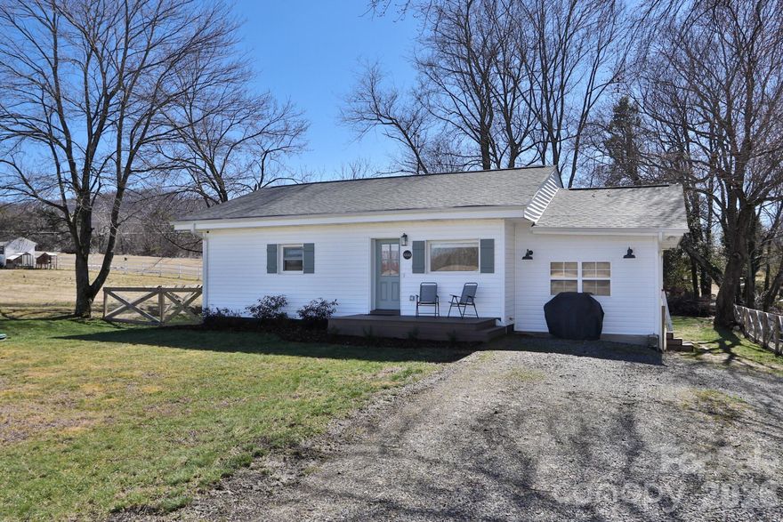 Charming and beautifully updated 2BR/2BA cottage tucked away on a peaceful dead-end street in a quiet country setting. Located in the heart of the Swan Creek Wine Region w/close proximity to local vineyards. Inside, the entire home showcases a fresh neutral palette & airy feel. The bright, modern kitchen is both stylish & functional, featuring abundant cabinet space w/ included refrigerator. The primary suite offers a relaxing en-suite bath with soaking tub & walk-in closet. A newly added family room with a built-in entertainment center offers the perfect space to relax, while the mudroom adds everyday functionality. Additional highlights include indoor laundry, UV Filtration system and fenced backyard with firepit and views of the rolling hills. The unfinished basement provides generous storage space, workshop potential, & endless possibilities. Move-in ready with the perfect blend of charm & location with scenic surroundings —just 8 minutes from downtown Elkin. Schedule a tour today!