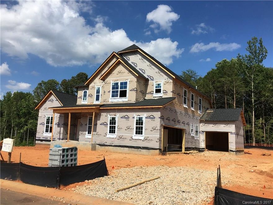 Master down plan that features an elegant two-story foyer, 12’ ceiling with arched entry with columns into the dining room, 10’ ceilings in the family room, and an open staircase that opens up to a 2nd floor loft with a step up into the spacious rec room.  This home also includes a covered porch perfect for entertaining.  Great Fort Mill location with great schools and an amenities package that includes a pool, lazy river, clubhouse with fitness center and theater, and a playground.