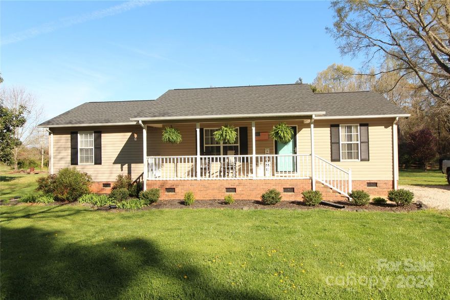 Wow! Tastefully decorated, Vinyl-sided ranch style home with 3 Bedrooms and 2 Bathrooms located on a level 1 Acre lot.  This home has approximately 1261 heated square feet and features a split bedroom plan. LVP flooring used throughout the majority of the home. Refrigerator, Washer and Dryer remain with the home.  HVAC System was replaced in 2020. New Roof was installed in 2021. Rear Deck was replaced 4 months ago. Granite Countertops were added in the kitchen in 2022.  Do not miss the opportunity to see this home!