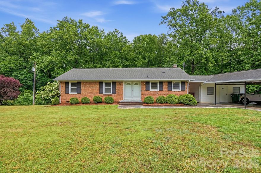 Located on over an acre of land between Hickory Grove and Hickory Ridge in Charlotte, this home has a lot to offer! Lots of space, with 3 bedrooms and 2 full bathrooms situated on the main level, plus a walk-out basement that leads you into the gently sloping back yard. The detached garage would be perfect as a workshop or ready to be transformed into a workout room. The main level has a classic layout for its era, with a cozy eat-in kitchen and large living with gas log fireplace and beautiful wooden beams crossing the ceiling, plus another living room/den (added later) with vaulted ceiling. The basement features another living area with fireplace, this one wood burning, and laundry closet. This home has great bones and is ready for its next adventure - come take a look today.