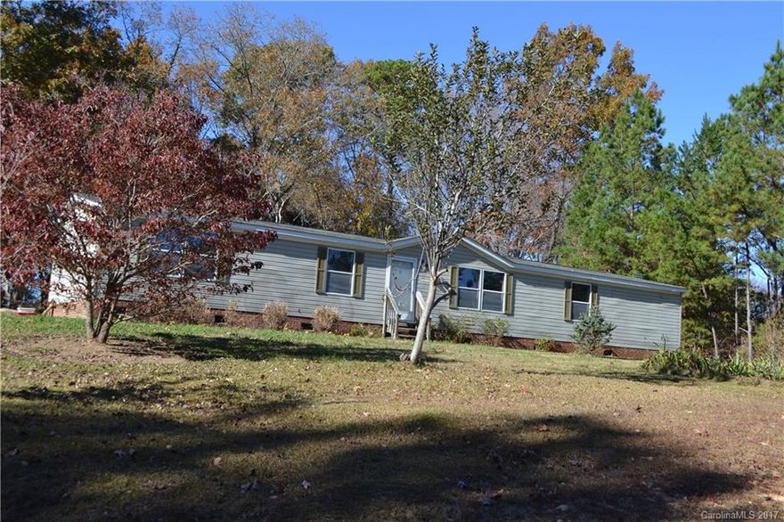 Affordable, country living in Indian Land! Beautiful wooded 1 acre lot close to shopping and in award winning schools! This is a rare opportunity you don't want to miss out on! Home is clean and in move-in condition. Home has a shed that conveys with it as well!