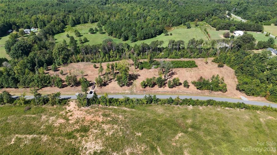 Don't let the last buyers cold feet keep you from looking at this HOT buy!  This Is What You Are Looking For!! 2.25 Acres - "Unrestricted" - Land in POLK COUNTY suitable for development, a Home, A Private Estate, Livestock, Horses, Mobile Homes, an RV Set Up - Even a Tiny Home - (As long as it  meets the County's requirements!!)  This is the Diamond you have been mining for!!  Want to put in an RV pad and use it when you are passing through - You Can!  Want to raise livestock, & have horses, chickens, goats etc?  You Can! Are you on a budget and want to put in a mobile home or a smaller home?  You can!  Four cleared & level 2.25 Acre lots available. Recently surveyed, subdivided!  Driveway approval from DOT in hand!  4 bedroom Septic permit IN HAND !!   This is Your Opportunity to have flat, cleared, unrestricted land, near TIEC, Near Landrum, I-26, Tryon, Columbus - Hard To Find! Call Agent Today!! (* Listing Agent Is Part Owner *)