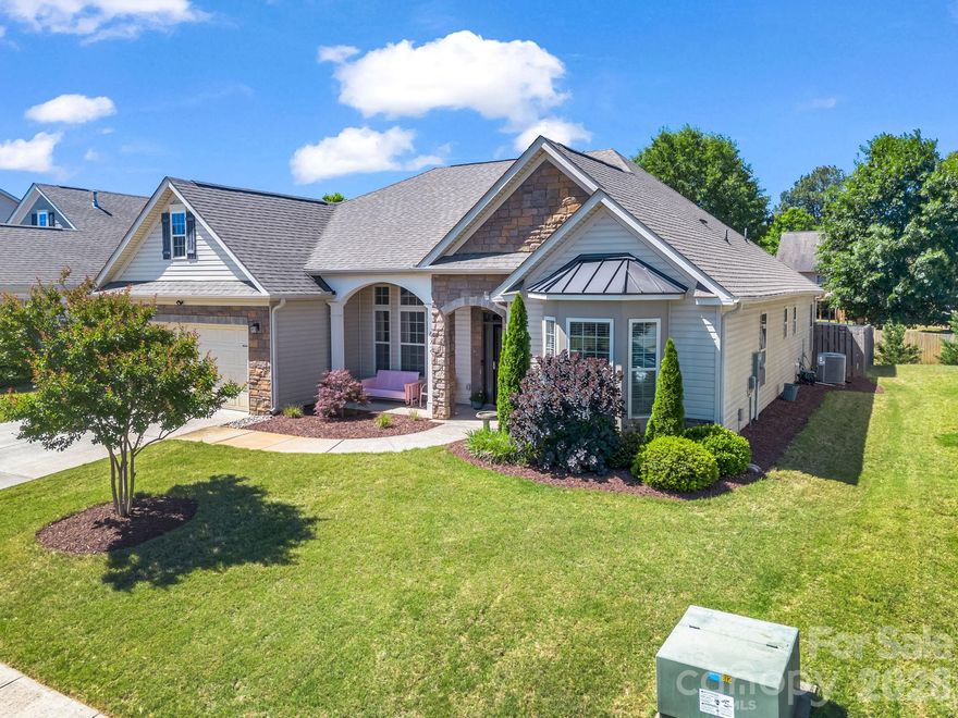 Welcome to Ridgeville Crossing, one of Inman’s most sought-after communities! This beautifully maintained 3-bedroom, 2-bath home offers 2,182 square feet of thoughtfully designed living space, all on one level. The desirable open-concept floor plan features soaring vaulted ceilings, abundant natural light, and new flooring throughout, creating a bright and inviting atmosphere. The spacious living area flows seamlessly into the kitchen and breakfast area, making everyday living and entertaining effortless. A formal dining room with an elegant, coffered ceiling provides the perfect setting for gatherings, while the versatile flex room offers endless possibilities as a home office, den, playroom, or hobby space. The spacious primary suite is a relaxing retreat, complete with a tray ceiling, large walk-in closet, and an impressive en-suite bath featuring a tiled shower, garden tub, and dual vanity. Two additional bedrooms and a full bath provide comfortable accommodations for family or guests. Step outside to enjoy the covered back patio and privacy-fenced backyard, an ideal space for outdoor dining, entertaining, or simply unwinding after a long day. Conveniently located near Lake Bowen, Woodfin Ridge Golf Club, and the shopping and dining destinations along Highway 9, this home offers the perfect balance of comfort, convenience, and lifestyle. Located within Spartanburg District 2 schools, this move-in-ready home is one you won't want to miss!