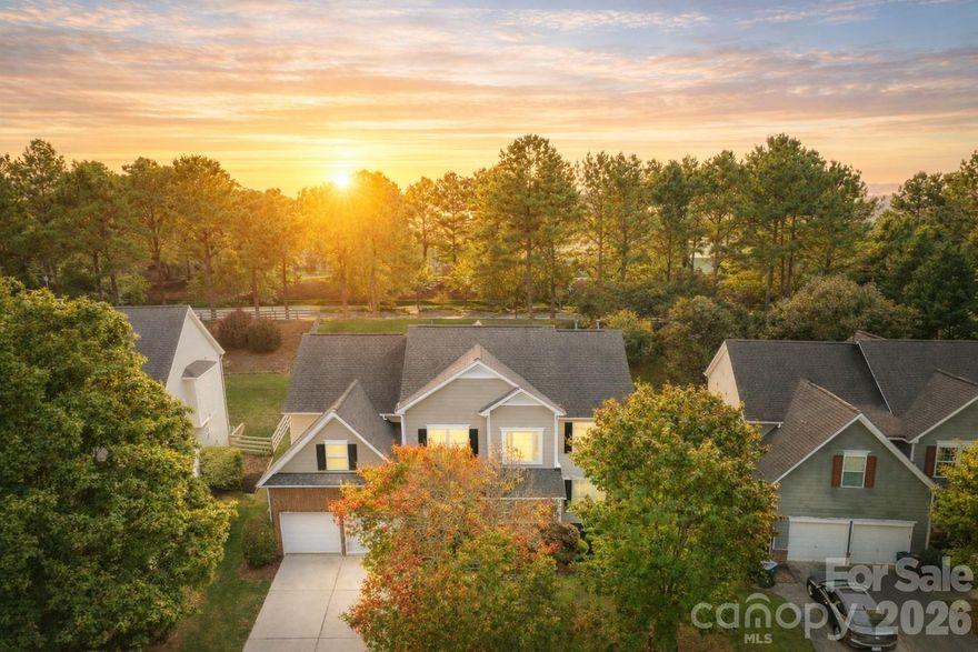Located in the highly coveted Morrison Plantation, this stunning 5-bedroom, 2.5-bath home offers over 3,400 sq. ft. of stylish, move-in-ready living space. Step into the dramatic two-story foyer and experience the seamless flow of the open-concept design, enhanced by soaring 9-foot ceilings that create a bright, airy feel throughout the main level.

The main level features gorgeous updated flooring, a formal dining room, a private office, and a guest bedroom—perfect for visitors or a second office space. The large kitchen shines with an island, abundant counter space, and ample storage with additional cabinets.

Upstairs, discover four generously sized bedrooms and a flexible media room ideal for a home theater, playroom, or 6th bedroom. The luxurious primary suite is an oversized retreat with a soaking tub, a walk-in shower, and a spacious walk-in closet.

The exterior showcases durable James Hardie® fiber cement siding paired with classic brick, all framed by mature trees and beautifully maintained landscaping.

Step outside to your private backyard oasis, perfect for entertaining, relaxing, or playing. Enjoy weekend barbecues on the patio, set up a firepit for cozy evenings, or create your dream garden—this outdoor space is ready for it all.

Recent upgrades include entire home updated flooring, a brand-new main-level HVAC, EV charger in the garage, modern light fixtures, and fresh interior paint—making this home completely turn-key.

Outside your door, enjoy Morrison Plantation’s unmatched lifestyle with a pool, clubhouse, tennis and pickleball courts, and a full calendar of community events. All this is just minutes from shopping, dining, Lake Norman, and award-winning schools.