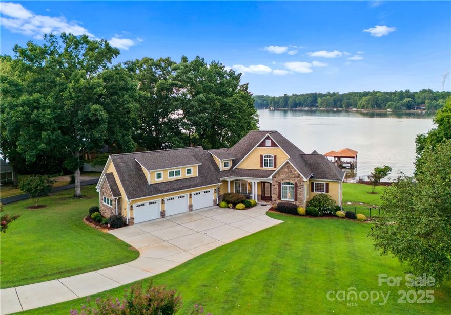 HUGE PRICE IMPROVEMENT.  Dream home on LKN, wide-open, stunning views are the highlight of this magnificent property. Imagine waking up to breathtaking lake vistas from your large deck, taking a refreshing dip in your saltwater pool, or docking your boat at your custom dock – the perfect trifecta of luxury and leisure. This home boasts a gourmet custom kitchen with coffered ceilings, seamlessly blending elegance and functionality. The large primary suite on the main offers a tranquil retreat with premium finishes. Cozy up by the fireplace in both the family room and living room, creating warm, inviting spaces for relaxation and entertaining. The lower level is a haven for guests or extended family, featuring a separate kitchen and ample living space. Rest easy with the assurance of a whole-home generator, ensuring uninterrupted comfort. Every detail in this exquisite Lake Norman home speaks of sophistication and refined living. Don’t miss the opportunity to own this slice of paradise.