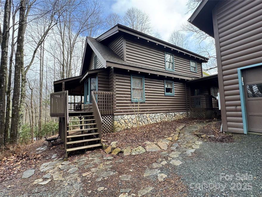 This is your chance to own a mountain home getaway or a successful short term rental property! Well maintained 3BR, 2 1/2 BA log home offering 2,059 sq ft of living space in a private, peaceful setting centrally located between Boone and Blowing Rock. The home features a spacious great room with wood floors, stone gas fireplace and an abundance of natural light alongside an inviting dining area and well equipped kitchen. The main level also boasts a large primary suite with private deck access. Outside, enjoy a large deck with outdoor fireplace  and a covered hot tub. Not included in the square footage is an almost 700sq ft living area with full bath above the garage which is ideal for office, studio or rental unit. Wide covered porches, ample storage and yard space complete this turnkey property, which comes fully furnished and proven short term rental success.