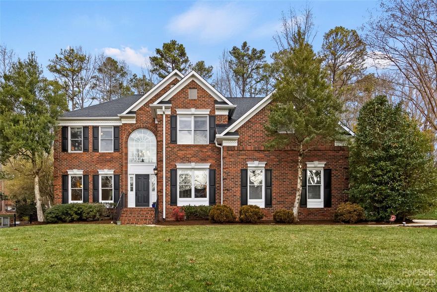 Nestled in an ideal Matthews location near the heart of south Charlotte, this home offers both convenience and gracious open living spaces! A soaring 2-story foyer w/ a turned staircase & lovely millwork welcomes guests. Well-lit formal areas w/ cased windows & an office w/ French doors flank the foyer & wood flooring runs through the main. The family room w/ gas log fireplace & wet bar opens to the large breakfast room & kitchen w/ granite counters, tile backsplash, double pantries, a built-in desk, SS appliances & an island w/ a breakfast bar. Dual staircases lead to a primary suite w/ a spacious sitting area, walk-in closet, & bath w/ dual vanities, tiled shower & separate tub. One additional bedroom up w/ an en suite bath plus two bedrooms w/ a Jack & Jill bath & a loft/bonus room w/ vaulted ceiling complete the upstairs. An oversized deck & paver patio overlook the fenced backyard. Zoned for sought-after public schools & close to many area private schools, The Arboretum & Waverly!