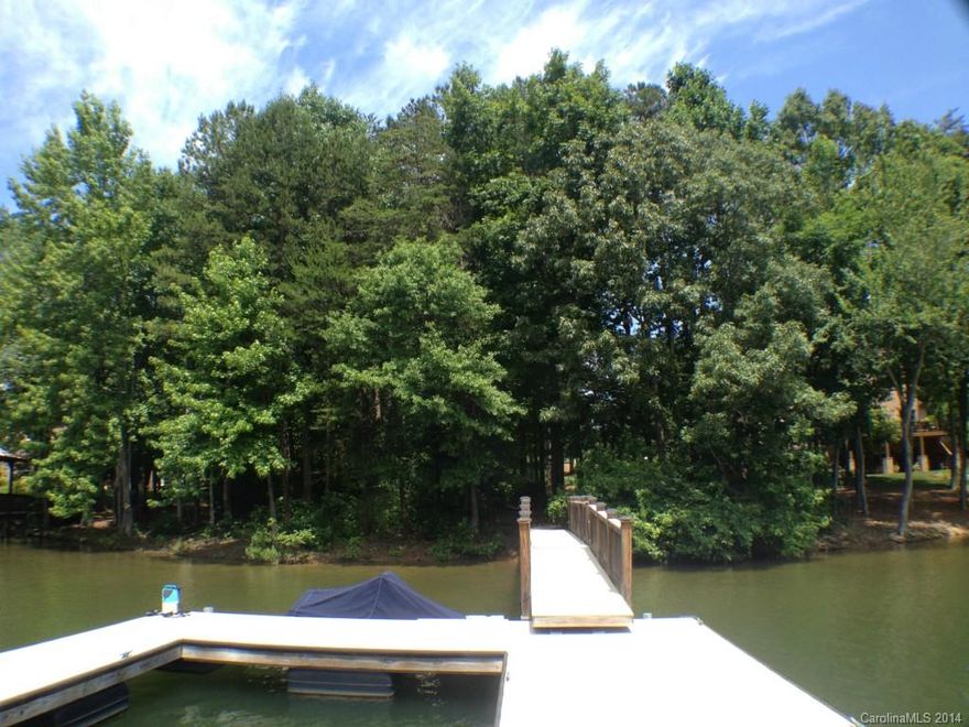 Spectacular waterfront lot with private pier and floating dock made of composite decking. This lot is perfect for building your dream home nestled at the end of a quiet cul-de-sac on deep water with amazing views surrounded by wonderful custom homes. Sailview offers something for everyone Jr Olympic size pool, tennis courts, volleyball courts, clubhouse, walking trails and 2 playgrounds. Sailview is a great place to call home with quick commutes to Uptown Charlotte and Douglas International Airport.