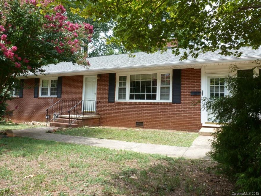 Brick Ranch home with unfinished basement in Belmont. Three bedrooms, two updated full bathrooms, eat in kitchen, dining room, living room. Great sunroom with new flooring. Nice finished Laundry room downstairs. Original hardwood floors throughout home, windows have been replaced, see through gas log fireplace. Concrete driveway goes to back of home. Quaint street off of Main Street within walking distance to downtown Belmont.