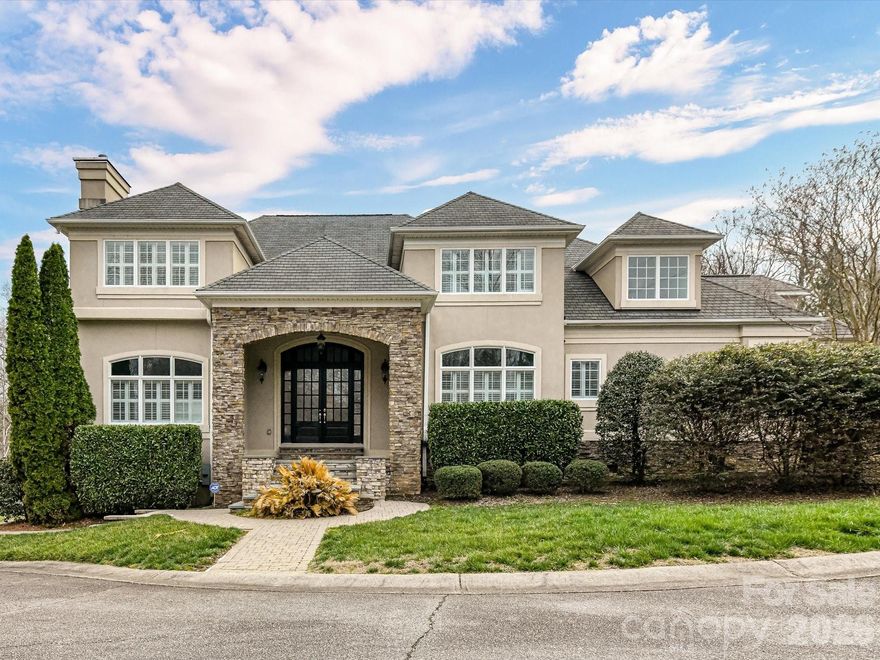 Welcome to an extraordinary waterfront estate on Mountain Island Lake, where luxury living meets breathtaking natural beauty. Tucked away in one of the area's most highly sought after communities, this remarkable property offers over 7,600 sq ft of refined living space designed for both grand entertaining and everyday comfort. Featuring six spacious bedrooms and 4 full baths plus one half bath, the home blends timeless elegance with modern sophistication. Expansive living areas are filled with natural light and showcase stunning water views, creating a seamless connection between indoor and outdoor living. The fully finished walk out basement offers a kitchenette, bar, movie room and large flex space (currently being used as a gym) as well as two additional bedrooms. The three car garage ensures plenty of room for parking and storage. Step outside to experience true lakefront living at its finest. The beautifully landscaped grounds lead to an exceptional private dock-perfect for boating, sunset gatherings, or simply enjoying the tranquility of the water. With sweeping waterfront vistas and direct access to the lake, every day feels like a retreat. This is more than a home-its a lifestyle defined by space, serenity, and the unmatched beauty of waterfront living. All of this less than 30 mins from Uptown Charlotte. Also-don't miss the neighborhood pool, club house and tennis courts. This Mountain Island Lake home is a true gem!