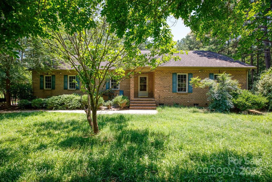 Nestled in the country side of Rock Hill, yet minutes from the interstate. This brick home has it all! The interior offers 3 spacious bedrooms, 2 full baths, an office with a storage closet, vaulted ceilings, beautiful built ins, hard wood floors, and a huge living room. The exterior has much to offer including over 5 acres, an oversized carport, a huge detached garage, covered patio, and an in ground pool. Come see this beautiful brick home!
