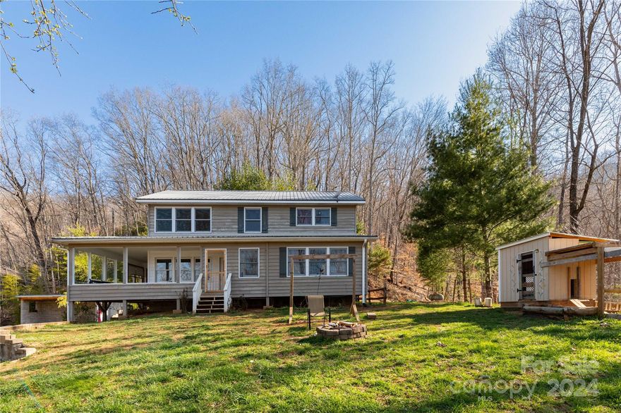 Price Reduction! Energy efficient gated home with gorgeous mountain views and lots of privacy, this home makes the perfect get away in the mountains of Western NC. New well pump and piping, tankless hot water heater, heat pump and energy efficient Bosch gas furnace in 2021! The home sits on a hill with beautiful views and flower or vegetable tiered gardening space outside the home.  The open living room area provide lots of natural light in the kitchen and living area.  The loft area upstairs provides an open bonus room along with 2 bedrooms and full bathroom. There is a large primary bedroom on the main floor and downstairs in the basement, there is a one car garage, full bath and a spacious bonus room in the back.  Come sit on the open front or back porch with firepit to view the beautiful mountains.  Close to gem mining, this property is within driving distance to the Cherokee Indian Reservation, Harrahs Casino, whitewater rafting, and the Great Smoky Mountain National Park.