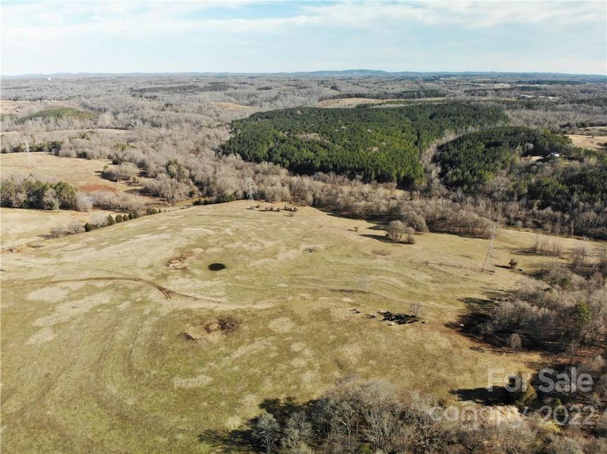 The possibilities are endless with this Cleveland County farm. Conveniently located just minutes from Shelby, this is a terrific investment tract. As you enter the property, you'll be met by pastureland with stunning panoramic views. You'll later notice the distant First Broad River, which borders the property to the South. With over 3,300' of river frontage, recreation abounds, from fishing and kayaking to hunting the ample wildlife that roams the river bottom. The park-like backdrop of the open river bottom offers an excellent opportunity to create walking trails or enjoy camping with the family. There are two ponds on the property, which could be great for fishing or providing water for livestock. With two access points from Red Road, you can sub-divide the acreage, if desired. This property would make the perfect place to settle down and call home with its short commute to Charlotte. Call for more details. Shown by appointment only.