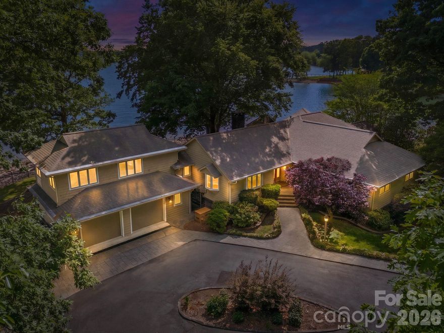 Positioned on a coveted stretch of waterfront, this distinguished residence is defined by its extraordinary setting and timeless appeal. Not many nicer views than this on Lake Norman. Encompassing approximately 3,000 square feet, the home offers four bedrooms, three full baths, office, and a versatile bonus room or additional bedroom overlooking the water, perfectly capturing the home’s most breathtaking views while balancing comfort, function, and enduring charm. At the heart of the home, a dramatic vaulted great room showcases rare wormwood-accented walls and an impressive stone fireplace, creating a warm yet striking gathering space. Expansive windows frame uninterrupted water views, while multiple living areas invite both quiet retreat and elegant entertaining. The primary suite is a private sanctuary, featuring dual walk-in closets and a spacious en-suite bath. Just off the primary bedroom, a dedicated office with a wet bar offers an ideal space for work or relaxation, all within steps of your own retreat. Outdoor living is equally compelling. A sprawling multi-level deck extends toward the water, complemented by two screened porches for year-round enjoyment of the serene surroundings. The private pier, complete with dock and gazebo, along with a dedicated boat launch, offers seamless access to the water, making every day feel like a getaway. The grounds are a true highlight, featuring a beautifully established rose garden and mature flowering landscapes that provide color, privacy, and a sense of tranquility throughout the seasons. A gated entrance and two-car garage further enhance the property’s exclusivity and convenience. Rich in character and set against breathtaking waterfront vistas, this is a rare opportunity to own a home where craftsmanship, natural beauty, and location come together in perfect harmony. Complete with an impressive 352 feet of pristine waterfront.