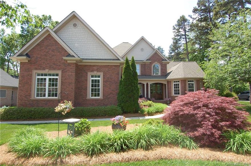 Gorgeous full brick home located on Fort Mill Golf Course! Rich hardwood floors throughout the main living area. 2story great room w/ beautiful custom cabinetry. Chef's kitchen boasts flowing granite countertops, SS appliances, breakfast area w/ amazing stone fireplace. Master suite on the main level & bath w/ relaxing jetted tub & spacious tile shower. Oversized bonus room & spacious secondary bedrooms. Enjoy the your private oasis in the sunroom or the beautiful stone patio w/ fire pit.