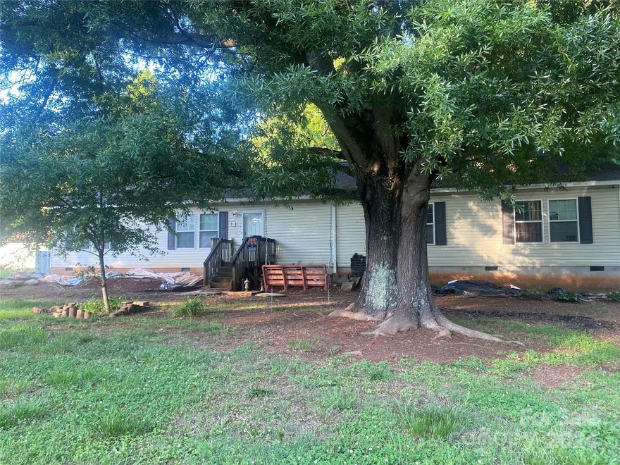 Priced to sell WAY below tax value. This home offers 2 bedrooms and 3 full baths. Walls can be put back up to create 3 or 4 bedrooms. Wood-burning fireplace was last used in February 2024. Flooring needed in house. Well pump does not work and there is currently no water to the home - buyer to fix. Broken window on right side of house. Back porch needs to be removed. Un-permitted electrical work on back porch needs to be removed. Foreclosure process has begun and a sell date has been set. Must be a quick closing.