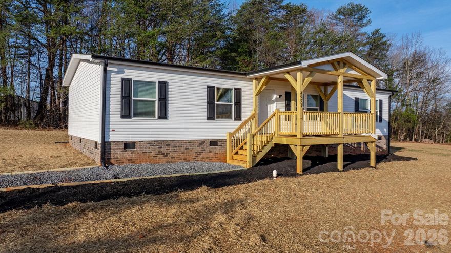 BRAND NEW! Completed in 2026, this three bedroom, two bathroom home offers 1,500 HSF and is situated on a cleared, level lot in the quiet countryside off Hwy 18 in Connelly Springs. Features include charming post and beam covered front porch, brick skirting, low maintenance vinyl siding, and a wall of mature trees in the backyard for privacy! Inside, the open floor plan offers LVP flooring, living room opening into the kitchen, which features all appliances, center island, stainless appliances and adjoining dining area. The split bedroom layout offers two bedrooms sharing a full bath on one end, a bonus room/office, and a private primary suite with huge walk-in closet and full bath on the opposite end of the house. Large utility/mud/laundry room. Seller offering closing costs assistance with acceptable offer.