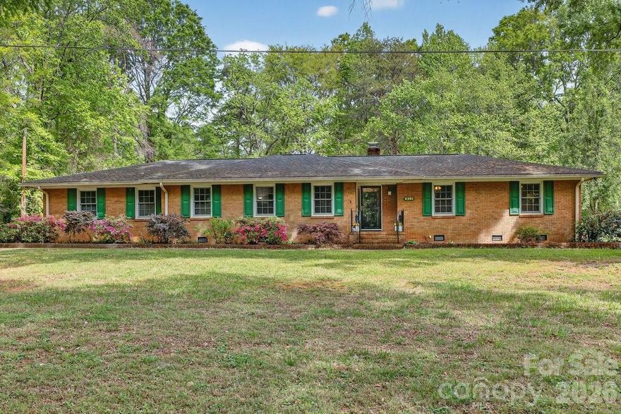 Expect to be impressed! Full brick 4 spacious bedrooms , 2.1 bath home w/2-car garageon an almost 1-acre lot offering the perfect blend of “country living in the city.” Hardwood floors throughout most of the home, crown molding, formal living and dining rooms, and a cozy den with built-in bookshelves, speakers, and gas fireplace. Kitchen features solid surface countertops and stainless steel appliances, plus a laundry room with cabinets. HVAC updated in 2021. Enjoy outdoor living with a large deck accessible from both the den and primary bedroom—ideal for relaxing or entertaining. Additional highlights include ceramic tile baths, pocket door to kitchen, storage room in garage, brick-paved walkway and mailbox, beautiful azaleas, storage shed in back, and a spacious front and backyard. Green house in need of tlc.  This home is a must see!!