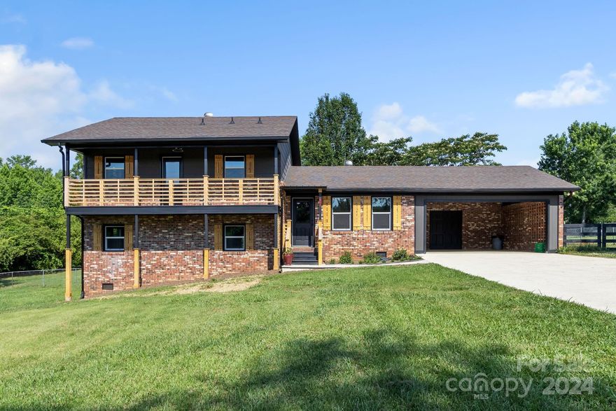 Dreaming of a lovely country family home close to town? Look no further! This beautifully UPDATED home sits on over an acre in a lovely country setting. NEW kitchen, appliances, baths, windows, floors, ductwork...Charming 3-bedroom, 3 bath home with a picturesque front balcony in the desirable Springdale neighborhood. This home features a bright-and-airy living room, large family room with fireplace, a modern kitchen with stainless steel appliances, and a private master bedroom with a huge walk-in closet. The fenced backyard is a peaceful retreat with mature trees and two oversized garden sheds, one is 24x16! Conveniently located near downtown, easy access to shopping, dining, I-26 & Hwy 74. With recent updates too many to list, this gem is move-in ready.