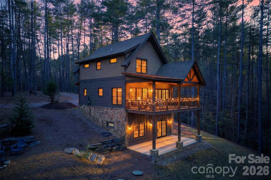 Beautifully designed and furnished, this move-in ready retreat in the highly sought-after Old Wildlife Club at Lake James offers the perfect blend of comfort, functionality, and mountain-lake living. Thoughtfully designed to maximize space and livability, 103 Big Game Drive comfortably sleeps 10 and offers an ideal setup for entertaining guests, weekend getaways, and enjoying the lake lifestyle.

The home features 4 bedrooms, 3 bathrooms, two spacious living areas, and two fireplaces, creating inviting gathering spaces on both levels of the home. The lower-level living room is perfectly suited as a game room, media space, or guest retreat and includes a sink, mini fridge, and granite-topped cabinetry for easy entertaining.

Enjoy the peaceful mountain setting from the expansive covered back porch—ideal for morning coffee, relaxing after a day on the lake, or hosting family and friends. Offered furnished, this home allows for an effortless transition into enjoying everything Lake James has to offer from day one.

Ownership includes access to the exceptional amenities of Camp Lake James, including pickleball and tennis courts, a resort-style pool, hot tub, fitness facility, and on-site restaurant. A deeded boat slip is also included, providing easy access to boating, swimming, and endless lake adventures.

Whether you are searching for a mountain getaway, vacation home, or investment opportunity, this property offers an incredible opportunity to enjoy the Lake James lifestyle in one of the area’s premier communities.