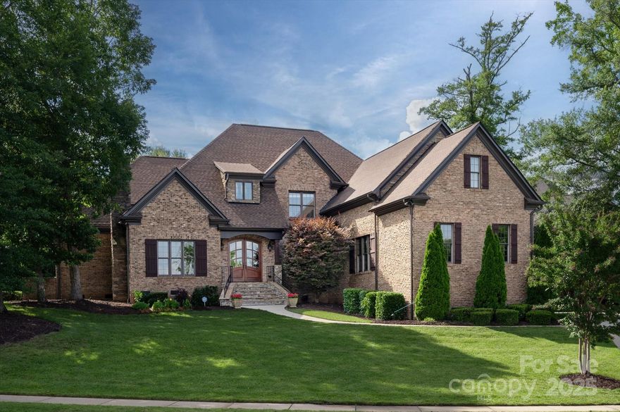 Beautifully updated custom home in gated Providence Downs South with completely private backyard.  Main level features updated kitchen with quartzite countertops and professional level appliances.  The breakfast area overlooks the backyard which features screen porch, fireplace, pergola and covered terrace.  The primary bedroom is on the main level with updated primary bath and completely custom closet. Main level office makes working from home a privilege!!  Upstairs are 3 oversized bedrooms, all with ensuites.  The media room is MADE for movie night and a great game of cards.  The wooded views in this home are amazing!  Pride of ownership shows in this home - very well maintained and thoughtfully updated.  PDS amenities include clubhouse, pond, volleyball, playground, pool w lazy river, tennis and pickleball courts.