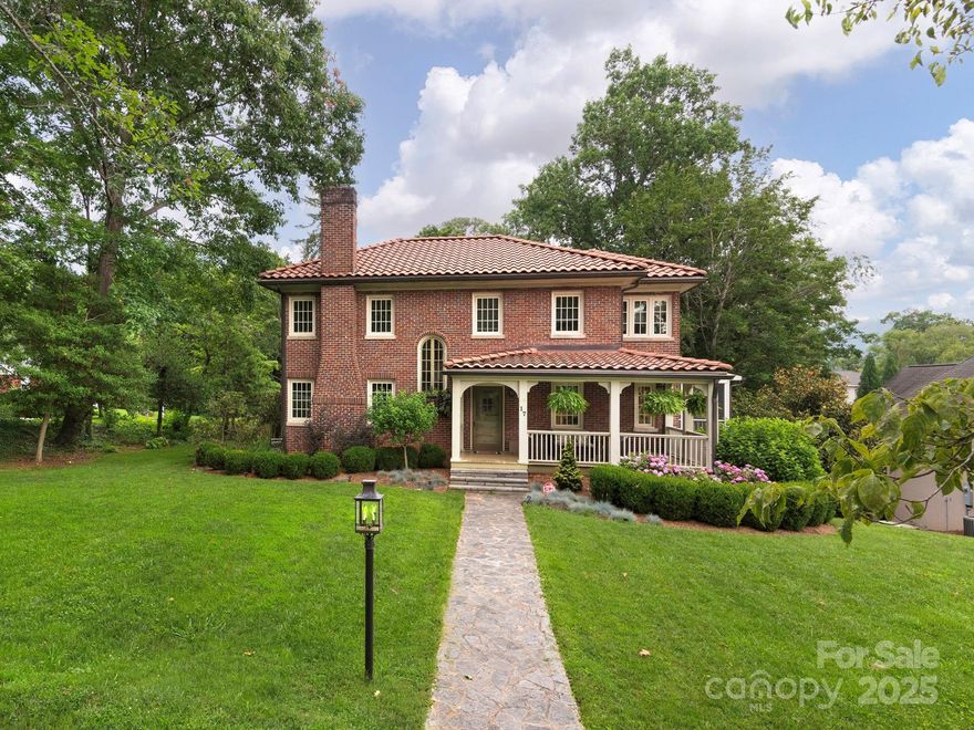 Luxury meets timeless elegance in this breathtaking 1920s masterpiece with picturesque views of Beaver Lake in Asheville’s coveted Lakeview Park. Offering a perfect blend of historic charm and modern sophistication, this beautifully renovated classic residence features gracious living spaces, bespoke open kitchen and dining, private study, an enchanting sunroom, and a screened porch ideal for morning coffee or al fresco dining with lake views. The designer chef’s kitchen boasts quartz countertops, premium appliances, and custom cabinetry. Upstairs, the spacious primary suite includes a fully renovated, spa-inspired bath. Two additional bedrooms, a stylish full bath, and a bonus room/office with lake views complete the upper level. The lower level offers a large den, a bonus room for guests, a full bath, ample storage, laundry, and an attached garage. Surrounded by mature landscaping on a gorgeous .35-acre corner lot, this exceptional home delivers Asheville living at its FINEST.