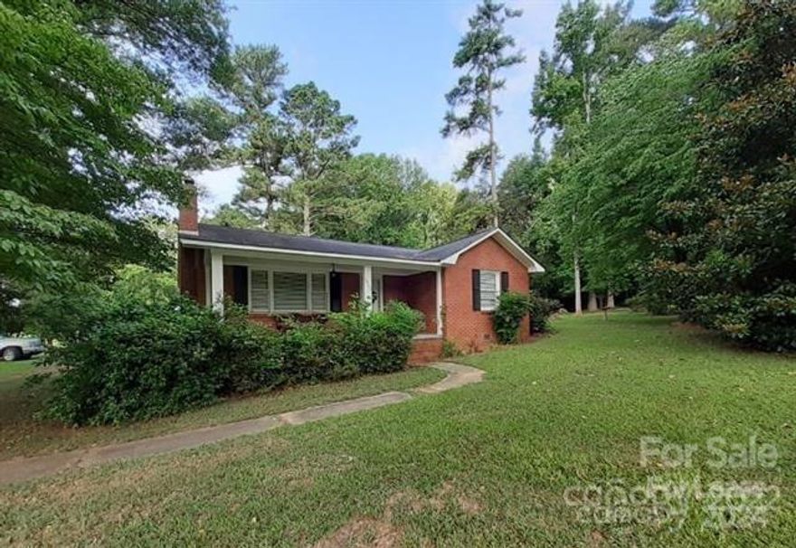 8.64 acres with Rental Home on Charlotte Highway - Beautiful brick home with 3BR and 2BA, living room and kitchen.  Flooring is hardwood and vinyl.  This home has a charming rear screened porch and a double, detached garage with plenty of room.  ***NO PETS***