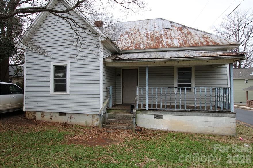 Priced to sell Investment Opportunity.  Corner lot with .23 acre. 2 Bedrooms, 1 Bath, Living Room, Kitchen and Utility Room.  Vinyl siding, metal roof, covered front porch with fenced backyard. Property has 1,100 unheated square footage. Needs TLC. Being sold "as is."  No repairs made by seller.