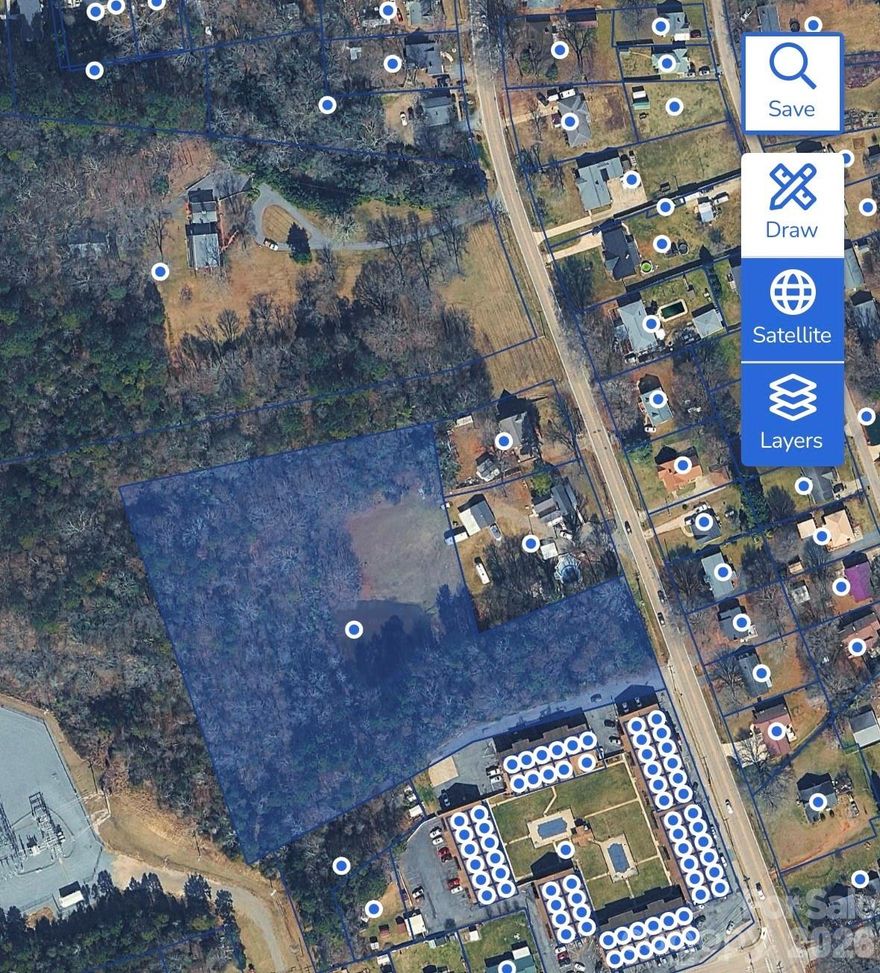 Kannapolis Land Rare ±5-acre infill opportunity along South Main Street in Kannapolis—positioned within an emerging growth corridor just minutes from downtown redevelopment, retail, and the NC Research Campus. The property is currently zoned R-4 and offers a compelling long-term investment profile for builders, developers, and 1031 exchange buyers seeking to secure future pipeline in a supply-constrained area. Adjacent residential uses, including nearby condos, support the potential for higher-density residential development (townhomes or similar), subject to rezoning. Public water and sewer are available; however, current municipal sewer allocation constraints are expected to limit near-term development. This dynamic creates a unique entry point to acquire well-located land at today’s basis ahead of anticipated infrastructure expansion. The site features approximately 5 acres with a natural topography that lends itself to a single-access residential layout. Conceptual planning suggests potential for a boutique subdivision or future attached product, depending on entitlement path. Ideal for: • Land banking / long-term hold strategies • 1031 exchange buyers • Developers building future inventory • Investors seeking appreciation tied to area growth Opportunities to acquire infill land along South Main with future development potential are increasingly limited. Buyers are encouraged to perform their own due diligence regarding zoning, utilities, and development feasibility.