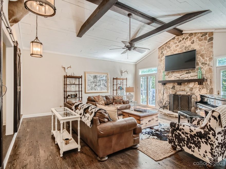 PRICE IMPROVEMENT! Imagine a peaceful afternoon relaxing in a hammock on your own private retreat of 10 acres! This farmhouse-style home is a short drive from the charming downtown Monroe, filled with restaurants, retail shops, the historic Dowd Center Theatre, and so much more. Easy access to Hwy 74 Bypass makes northbound trips a breeze. Fenced pastures along the private drive offer plenty of room for horses. The home is situated in the wooded part of the property, providing an extra private feel. Interior has many updates with custom styling; the oversized primary bathroom has been fully upgraded recently. The 16’x28’ screened porch connects the main living area and garage with an upstairs bonus room, nearly an additional 500 sq. ft. space; the porch is great for entertaining, rain or shine. Come see the potential!