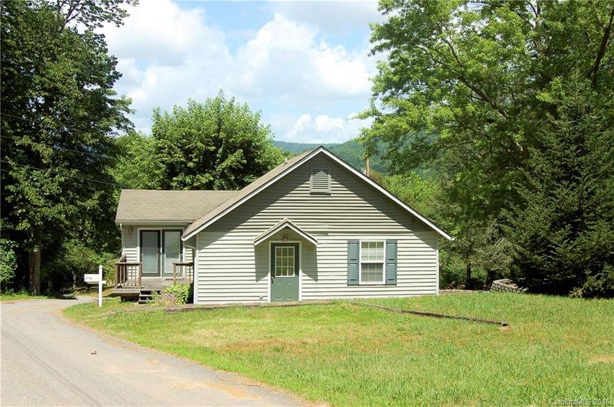 Adorable bright country home on level 1 acre lot with 2 babbling brooks on the property. Nicely remodeled 1940's home with 2 Bedrooms and 2 Baths. Great outdoor space for gardening, playing, or raising animals in the charming barn.  So peaceful and quiet yet just a few minutes to all the wonderful town of Burnsville offers. Fantastic rock patio with a built in rock grill. So close to so many mountain attractions. Come see what it's like to live a simpler, more gentle life!