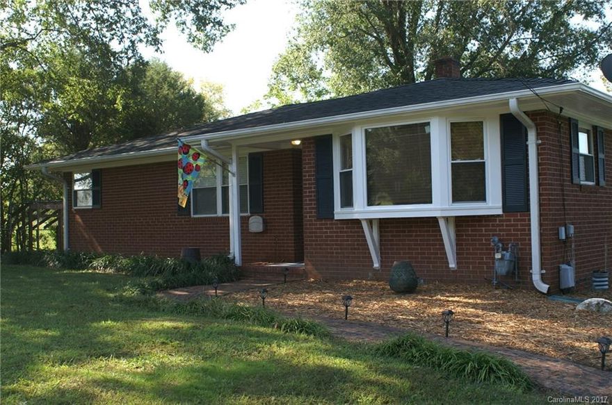 Enjoy a country feel and one-level living in this updated 3BR2BA "cute as a button" brick ranch.  Large kitchen with eat in area.  Tile and original refinished wood floors, fenced in back yard with mature shade tree.   Separate fenced in area for pets or chickens.  No HOA! Detached garage with area for workshop or storage.  Deck off the kitchen for outside entertaining.  Convenient to shopping!!  Don’t miss seeing this and making it your “home sweet home”.