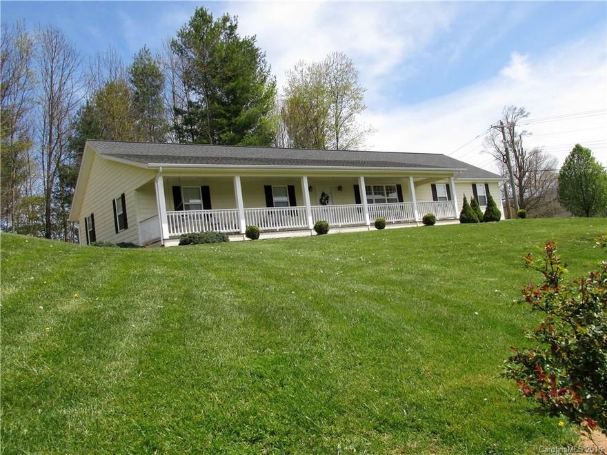 Close to Burnsville yet out of City Limits. Move in ready. Exceptionally beautiful hardwood floors throughout, Living room has large stone gas log fireplace and Vaulted Ceilings. All rooms are large size including the baths. Very tastefully painted. Come home to the covered front porch for mountain views and relaxing. Paved drive and two car garage. Lot is 1 ac so you have plenty of room for outdoor activities.