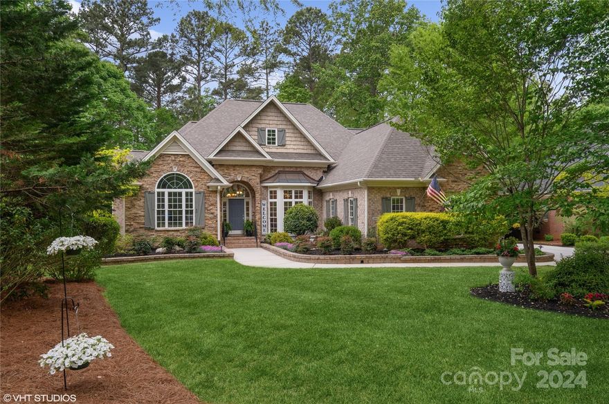 PEACEFUL & TRANQUIL!  Beautifully transformed 4 bedroom, 3.5 bath home is steps away from Lake Wylie. Landscaped yard, re-designed in 2019 & includes a custom fountain in the "Zen Garden".  Upon entering there is a warm feeling & pride of ownership. Quality detail in millwork & lovely hardwood floors. Family room & dining room are bathed in abundant light and open design, while the fireplace provides a place to snuggle on those cool nights. Spacious kitchen gives open gathering space w/ beautifully detailed natural cherry cabinets. New KitchenAid oven/convection microwave give the fussiest chef a reason to enjoy cooking! Four spacious bedrooms are filled with light and canopies of lavish green vistas. A study provides a "work from home" space. Lovely wooded, cul-de-sac lot, a screen porch & patio give space for relaxing and entertaining. Amenities of clubhouse & pool. Ebenezer Park is steps away with fishing & boating.  This home is exceptional and impeccably maintained!