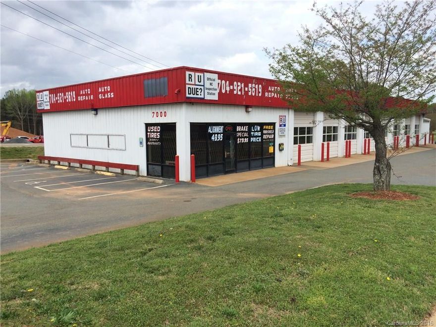 High visibility auto repair service center for lease.  Office area 1285 sq ft, separate from the 10 bays in the garage.  Equipment is for sale and will remain for use of tenant if purchased from owner.  Great site in the heart of the University area.  Repair Center is located on signalized corner of N Tryon and across from new Circle K gas station and Charlotte's Light Rail, traffic counts per NC DOT are 30,000 plus in the area.  Equipment in garage are lifts, air compressors, oil tanks etc.