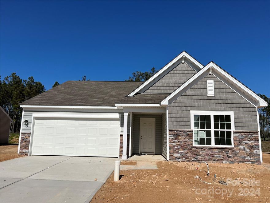Brand new community in a peaceful setting. The Elliot ranch plan offers a spacious open floorplan with a large Great Room and Kitchen with quartz countertops, single bowl sink, gas range and subway tile backsplash.  Walk-in shower and dual vanity as well as large walk-in closet in the primary bedroom. Don't miss this opportunity to live in a quiet beautiful community, with easy access to I-77 and Rock Hill and only 30 miles to Charlotte.