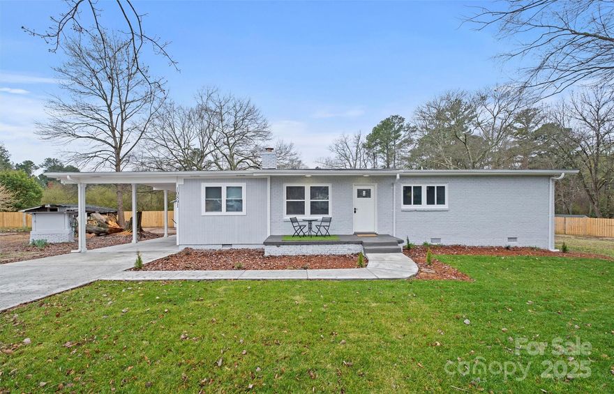 Location, location, location! Discover the charm of easy ranch living at 10891 Pettus Rd, a completely remodeled 3-bedroom, 2-bath gem on a lush 0.83-acre lot. This move-in-ready home features a bright open layout, custom kitchen with modern finishes, upgraded flooring, lighting, and fresh neutral paint throughout. Both baths are beautifully refreshed with spa-like tile showers and contemporary fixtures. Enjoy peace and privacy with wide-open yard space for outdoor living, gardening, or future expansion. Just minutes from Ballantyne’s shopping, dining, and commuter routes, you get country serenity without sacrificing convenience. Two septic tanks and a subdividable lot add flexibility and long-term potential. No HOA—bring your vision and make it your own!