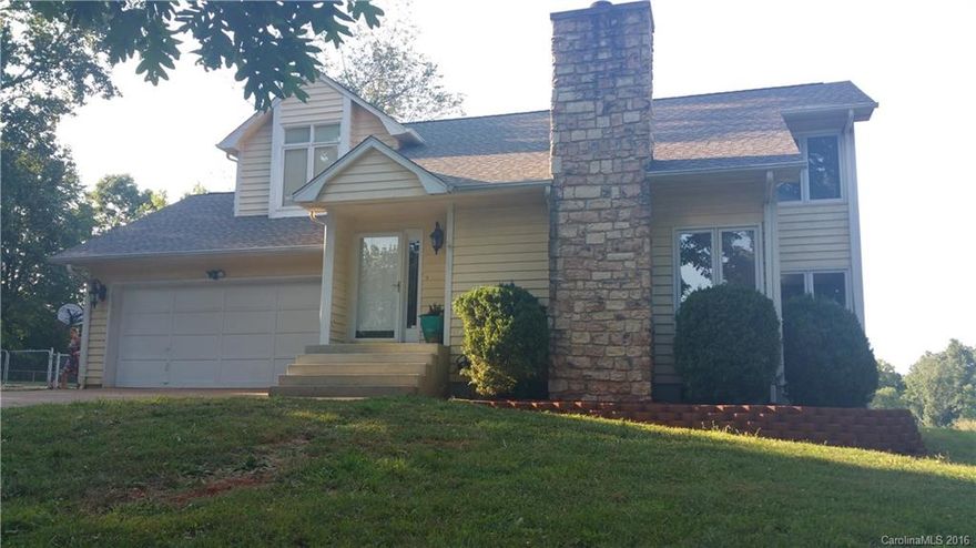 Cute home w/ architectural appeal & custom floorplan. Main level area has functional kitchen w/ breakfast area & see through to large dining area. Dining area opens up to large living room w/ elevated fireplace. Upper level offers large master suite w/ walk-in closet & vanity separated from shower & toilet. Guest bedrooms are good size w/ walk-in closets as well. Peaceful back yard w/ pasture bordering along rear and wooded lot to one side. Huge rear deck w/ hot tub & very nice outbuilding!