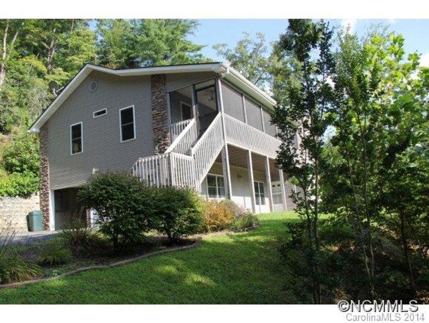 Central location to Dupont/forest.Winter views & beautiful sunset.2 screened/covered porches.Beautiful newer home.Huge master w/jet tub, large walk-in closet. Large laundry rm off kitchen, hardwood floors, gas vented stove. Lower level is walkout w/full bath & fold down murphy type bed. Perfect for guest/in-law suite. Immaculate house.Small creek.Enter from back driveway with only 3 steps. Wired w/switch for generator.Owner realestate broker