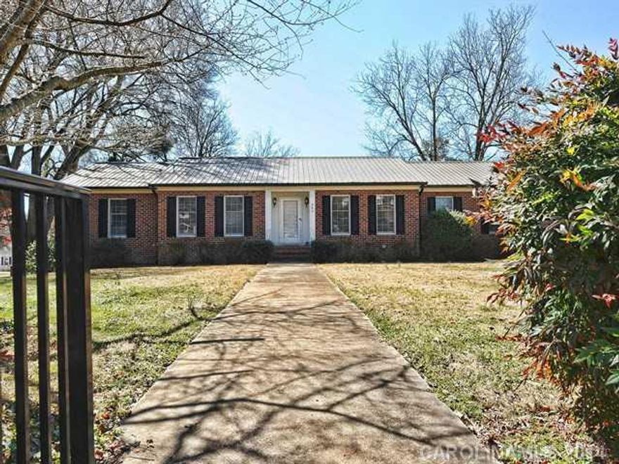 One of a kind brick ranch w/basement on Main Street in charming Rockwell.The possibilities are endless with this wonderful property sitting on 1.59 acres in a park-like setting.Large kitchen w/butcher block island,butlers pantry & dumbwaiter.Brick fireplace & built-ins in den.Master suite w/private deck & laundry chute.2nd living quarters in basement.Large deck,sunroom & extra garage.New HVAC.