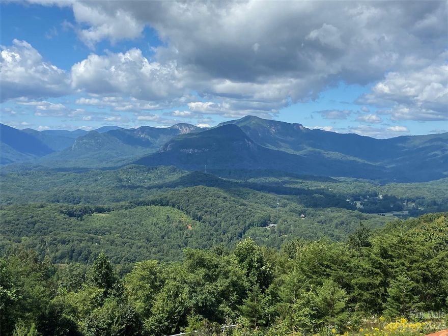 Come see this private homesite in Lake Lure's premier private gated community, Vista at Bill's Mountain. 
Enjoy breath- taking views overlooking the 8000-acre Chimney Rock State Park and Hickory Nut Gorge. 180-degree views to the SW, West and NW.  The driveway has been cut in from upper road on Half Moon Mile, for the best vantage point.  Amenities include nearby state-of-the-art clubhouse with fitness center, outdoor pool, tennis/ pickle ball court, walking trail, and guardhouse.