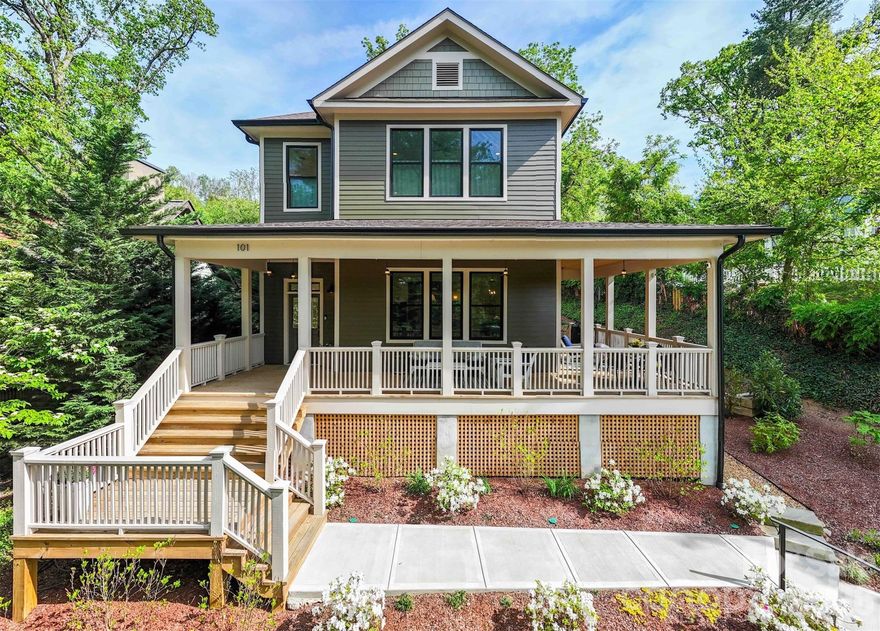 Historic charm meets modern elegance in this exceptionally beautiful home, built by a highly regarded local builder! A gracious wraparound porch sets the tone, inviting you to relax and unwind. Inside, 10-foot ceilings, hardwood floors throughout and expansive windows create a bright, airy feel. The main level features an open floor plan and a chef's kitchen with a quartz waterfall island, abundant cabinetry, and a dreamy walk-in pantry. A gas fireplace with a pull-down TV adds both style and function. A spacious guest bedroom and full bath complete the main floor. Upstairs, illuminated stairs with a custom railing lead to three bedrooms, including a generous primary suite with motorized room-darkening shades, a spa-like ensuite bath with waterfall shower and soaking tub, and a walk-in closet with custom built-ins. Low-maintenance yard backs up to a wooded area for added privacy and peaceful views. This home is so conveniently walkable to local restaurants, parks, and tennis/pickleball courts—offering the perfect blend of charm, comfort, and convenience. A must-see!
