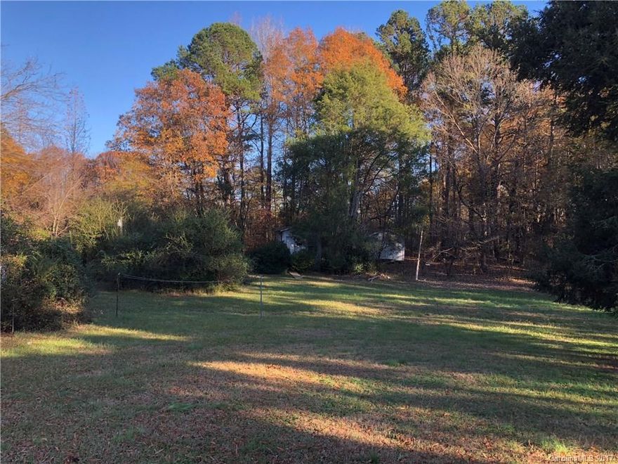 Amazing,gorgeous lot 2 acres,beside,additional 2.8,plus behind an additional 11.5 acres. Possible total acreage for residential or commercial:16 acres.Great location. Close to Hornets Nest Elem.In the city/Charlotte,city water/sewer.Perfect for developers/builders. Parcel behind is partially zoned commercial.The 16 acres could be zoned commercial/would be perfect for a subdivision.Call listing agents w/questions.Motivated seller.Close to Northlake Mall,485 & I-77.House/bldgs on prop of No Value