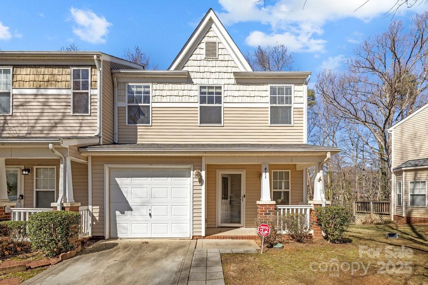 Don't miss out on this townhome in a gated community convenient to South End and Uptown Charlotte.  This home offers 2 primary bedrooms with ensuite bathrooms and walk in closets. Fresh new paint throughout.  Upgraded kitchen cabinets, granite countertops and stainless steel appliances.  Main level flooring is LPV, wooden stairs and carpeted bedrooms upstairs.  This end unit has a single car garage and driveway for additional parking with wooded privacy behind it. Minutes to I77, restaurants, entertaining and shopping. Community pool and dog park.