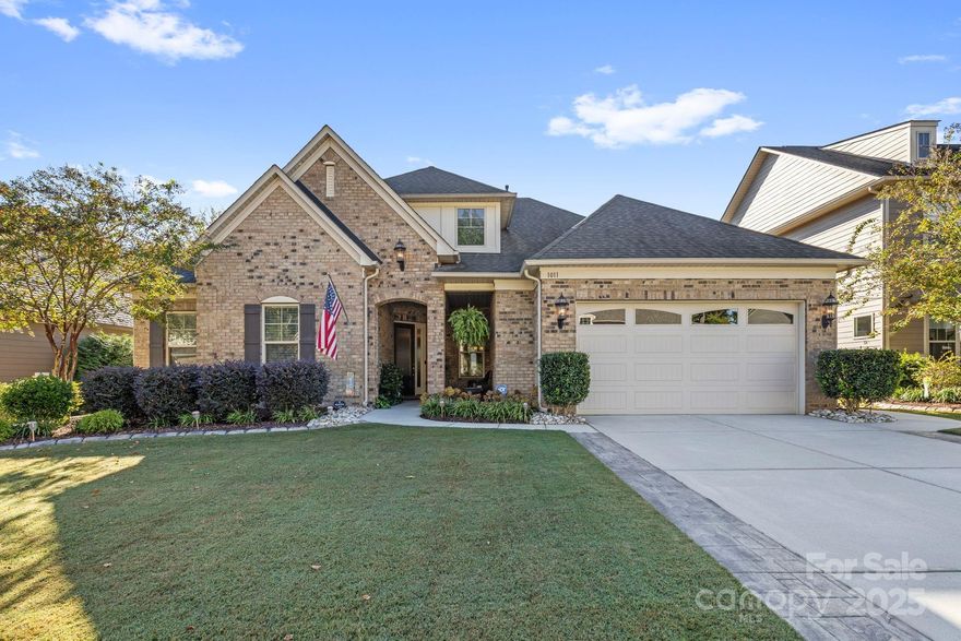 Truly luxurious living: this wonderful 1.5 story split-bedroom designed home features 10’ ceiling height down, 9’ ceiling height up, an open floorplan, a gourmet kitchen with customized walk-in pantry, and outdoor facilities/features designed for comfort, relaxation and entertaining with its expansive patios, coverings, views, and firepit. A covered front porch welcomes you home while a large home office is secluded and private enough to allow an ideal work-from-home environment/option. The primary bedroom has an adjacent sitting area while the bath features an oversized walk-in shower (with bench!), a large soaking tub, a private toilet, and a custom closet fit for royalty. All secondary bedrooms are spacious and feature walk-in closets. All rooms have ceiling fans to ensure year-round comfort and the living room features a corner stone fascia fireplace. The drop zone and utility room have custom cabinetry to maximize their appeal and use. And the location is superlative: welcome to Queensbridge, an enclave of exceptional homes convenient to Ballantyne, Fort Mill, Weddington/Waxhaw and the soon-to-open Costco. This is an extraordinary opportunity.