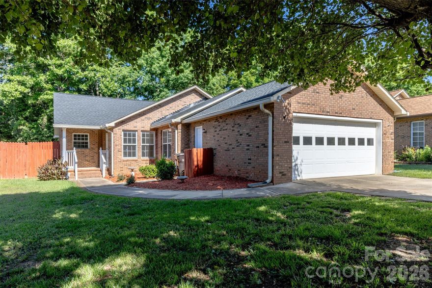 Welcome to easy living in the desirable Ravencroft community! This single level all brick home features 3 bedrooms, 2 bathrooms, and a functional split bedroom floor plan. The open kitchen, living, and dining areas are designed for comfortable everyday living. Enjoy new flooring throughout the home (2026) and a new roof (2025) for added peace of mind. The spacious primary suite includes a garden tub, separate shower, and two closets. The bright sunroom overlooks the private fenced backyard and leads to a new deck(2026), perfect for relaxing or entertaining. Need extra storage? The sizable outdoor shed stays! The true 2 car garage and large utility room with sink and washer/dryer hookups add even more practicality. Conveniently located just off Ebinport Road with quick access to I 77, downtown Rock Hill, Winthrop University, shopping, dining, and only about 30 minutes to Charlotte Douglas International Airport. Come see this hidden gem today!