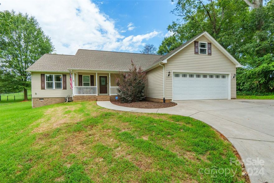 Welcome to this charming 3-bedroom, 2-bathroom ranch-style home in Maiden, NC, nestled on a spacious .87-acre parcel of land. The open layout seamlessly connects the living, dining, and kitchen areas, perfect for entertaining and everyday living. The living room features a cozy gas logs fireplace, adding warmth and ambiance to the space. The primary suite includes a luxurious walk-in shower, offering a spa-like retreat within your own home. This move-in ready home boasts brand new vinyl flooring installed on 8/27 and comes complete with stainless steel appliances. Don't miss this opportunity to own a beautiful property that combines comfort, style, and ample outdoor space.