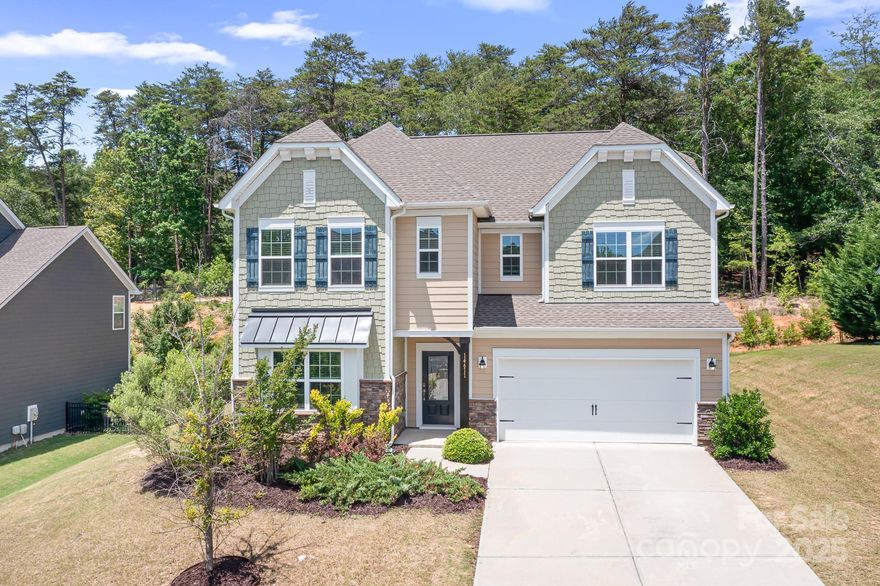 Perfectly thought-out space in this Palisades home! The open floorplan seamlessly connects the living room, dining & kitchen to create a central hub for entertaining or just relaxing at home. Hardwood floors throughout the main level. Office w/French doors for privacy. Modern kitchen w/upgraded cabinets, granite counters, tile backsplash, island w/breakfast bar, stainless steel appliances, gas range & walk-in pantry. Additional bonus room on the main level (playroom/office) & half bath w/linen pantry. Big primary suite w/dual vanity, granite counters, tiled shower & huge walk-in closet. Second primary bedroom also w/granite counters & spacious closet. Two additional bedrooms & guest bath w/dual vanity & granite counters. Backyard overlooks trees & has a built-in firepit/stove & paver patio. Resort style amenities- golf course community w/clubhouse, pool, walking trails, tennis courts & more! Easy access to airport, shopping, dining, Lake Wylie & Uptown. Some photos virtually staged.