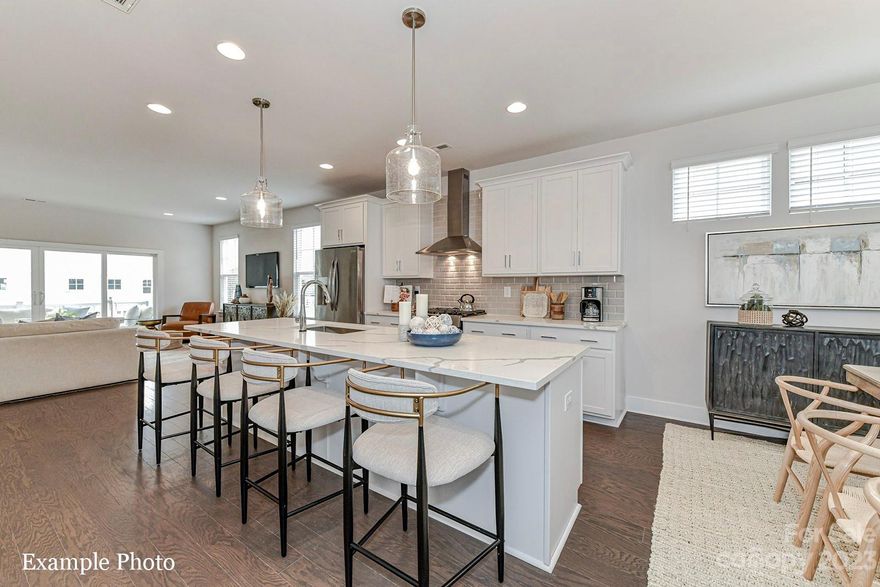 SELLER INCENTIVE OF UP TO $7,000 TOWARDS CLOSING COSTS OR LOWERING YOUR INTEREST RATE! "LAKESIDE LIVING WITH SMALL TOWN CHARM"... Located within the Historic College Town of Davidson and Adjacent to Lake Norman, This Craftsman Style Townhome with Modern Open Interior, Luxury Finishes/Features is within Walking Distance to Shopping, Dining, and Outdoor Recreational Activities. Enjoy a Low Maintenance Home and No Maintenance Yard. This Townhome Features an Office on the First Level, Deluxe Kitchen w/ Dark Blue Cabinets, Tile Backsplash, Stainless Steel Kitchen Appliances including Refrigerator, Gas Range, Microwave, Dishwasher, Upgraded Quartz Countertops, 6 Inch-Wide Hardwood Floors Throughout, Tray Ceiling in Owner's Bedroom and Bedroom 2, Extra-Large Walk-in Closets, Owner's Bedroom & Bedroom 2 both have Sitting Areas, Washer, Dryer, Electric Car Outlet in the 2 Car Garage, Blinds and More. Limited Number of New Homes in Popular Davidson, Tour Today!