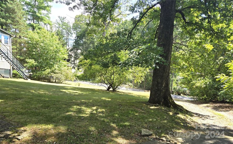 Gorgeous flat, easy build lot just minutes to town. Larger than normal property with plenty of room to build your custom or spec home. This property sits seconds from Mission hospital, the RAD, and has easy access to all that Asheville has to offer!